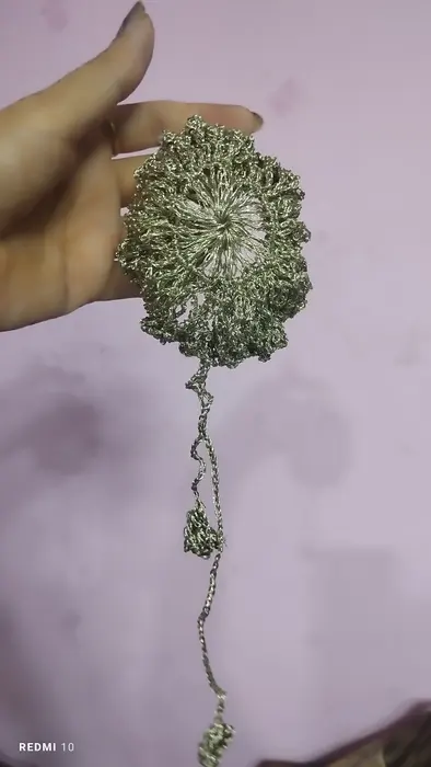 Handmade crochet shimmer flower hanging in silver & gold