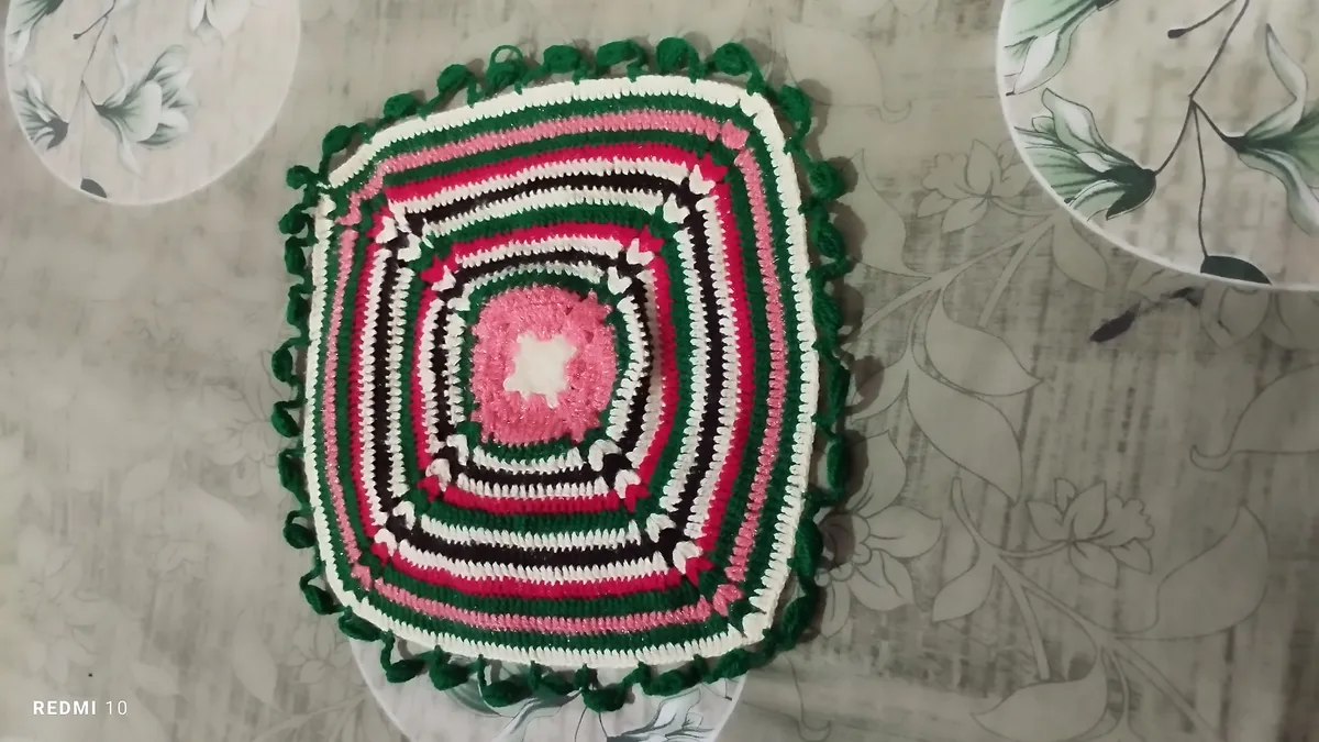 Handmade crochet square mat in pink, green & white