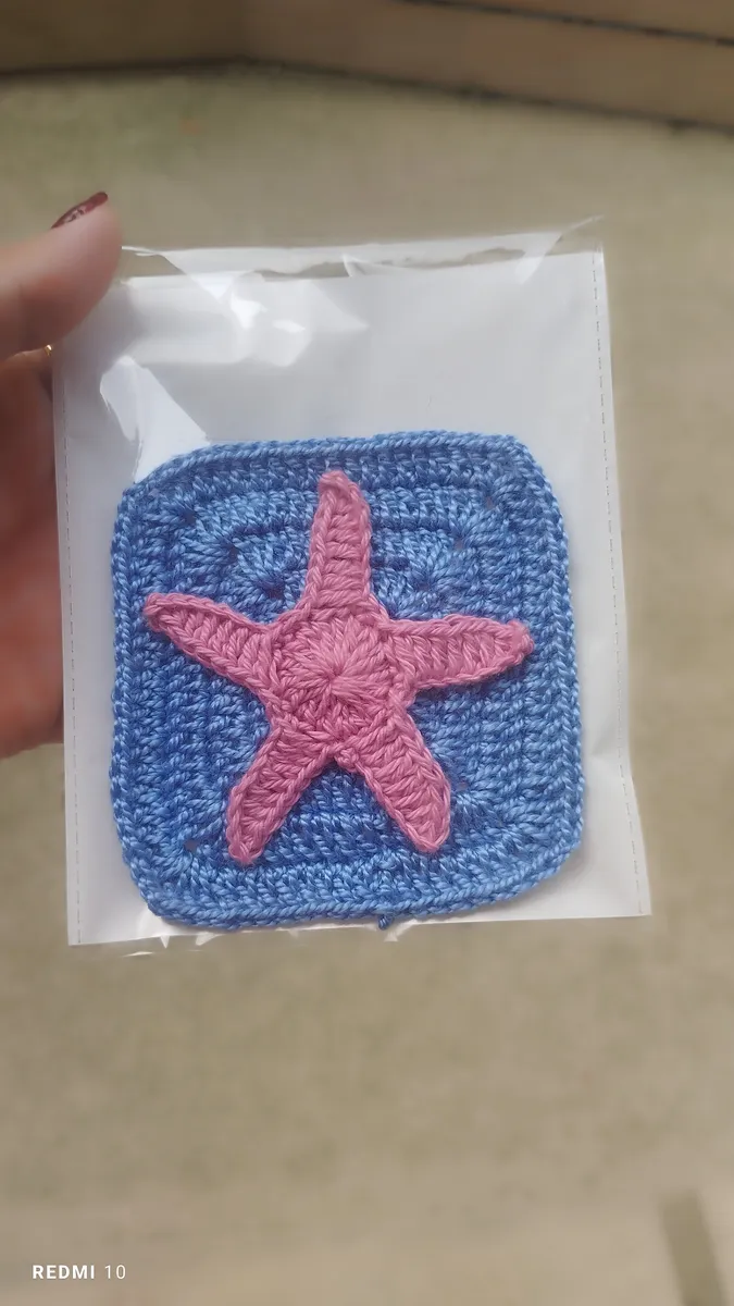 Handmade crochet starfish coaster in blue & pink
