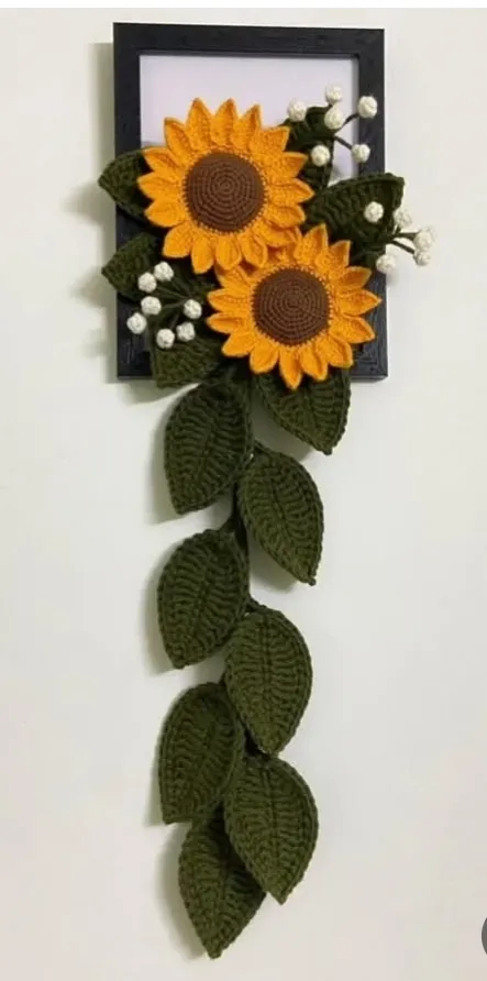 Handmade crochet sunflower wall hanging in yellow & green