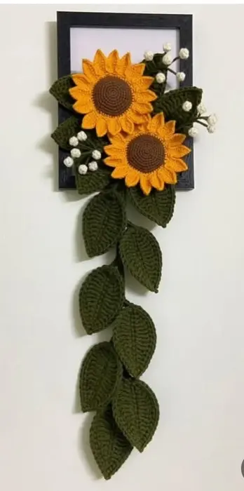 Handmade crochet sunflower wall hanging in yellow & green