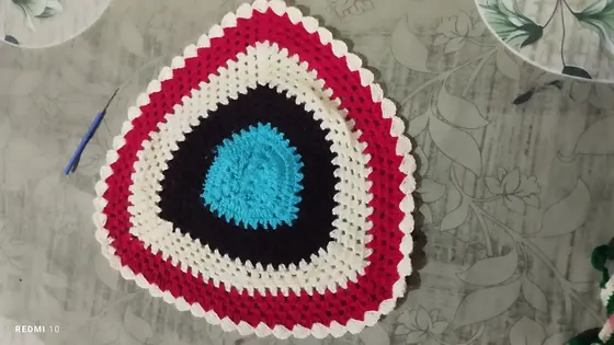 Handmade crochet triangle mat in multicolour