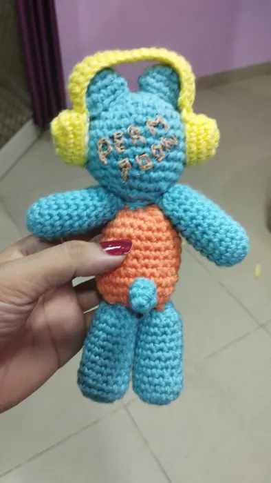 Handmade crochet teddy with headphones in turquoise & orange