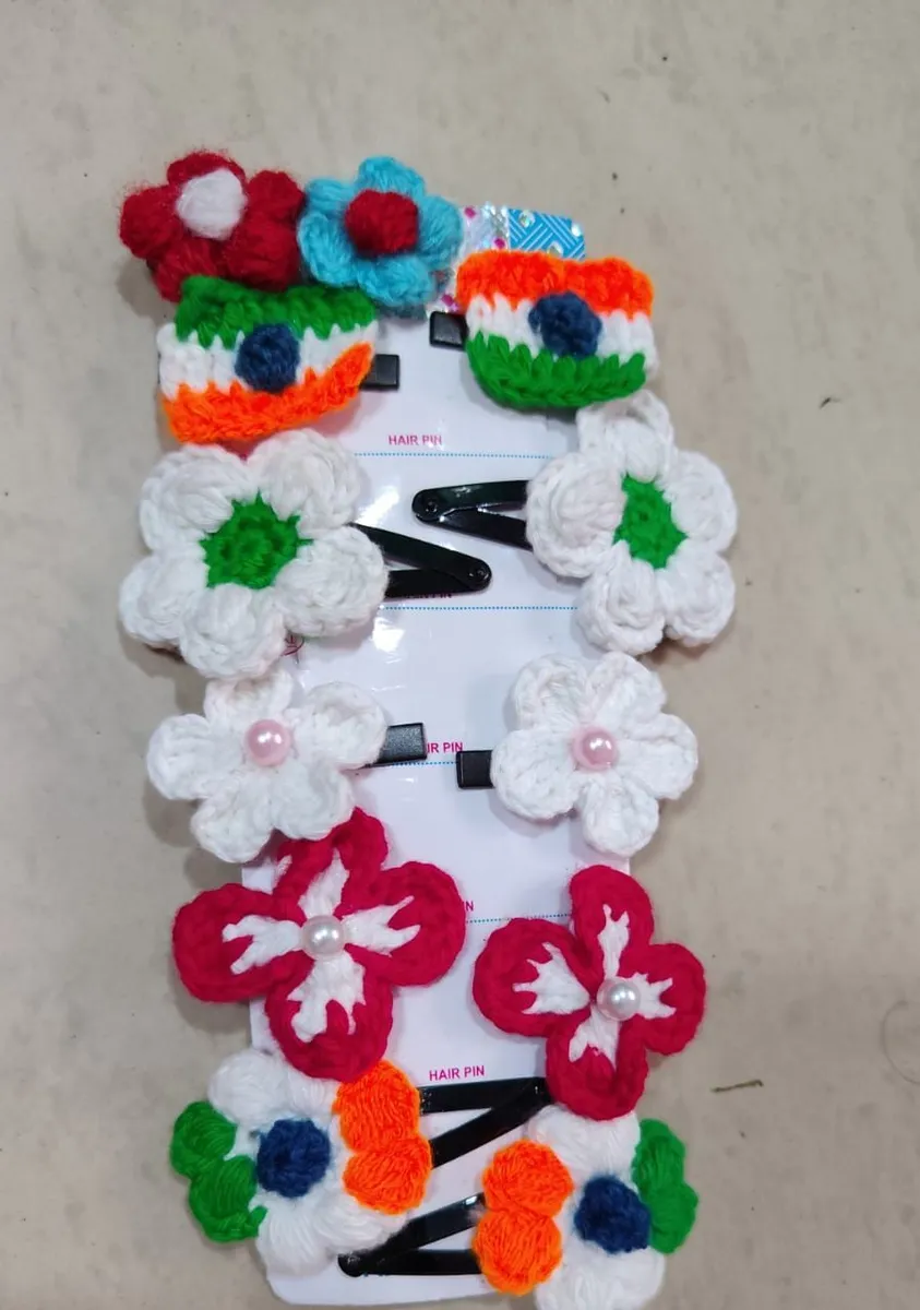 Handmade crochet flower hair clips in white, orange & green