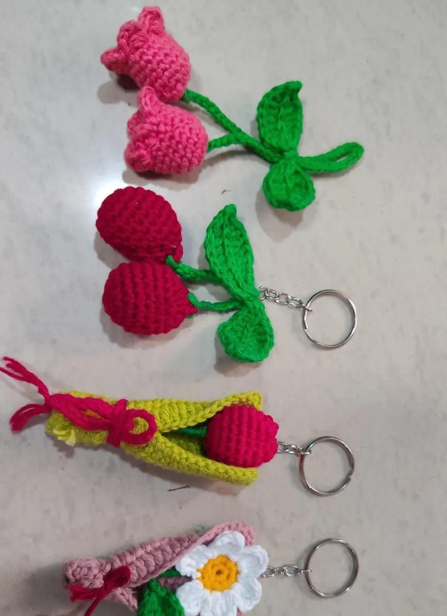 Handmade crochet cherry, tulip & daisy keychains in red, pink & green