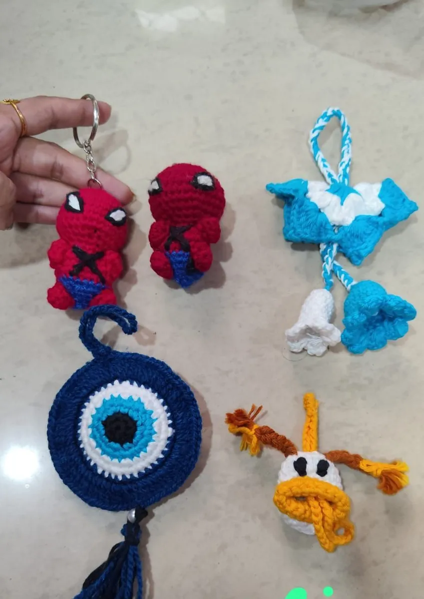 Handmade crochet evil eye, duck & bell charms in multicolour