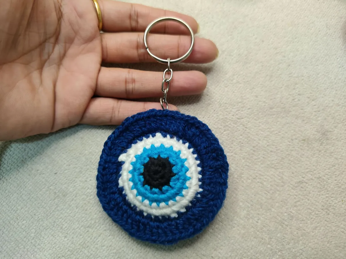Handmade crochet evil eye keychain in navy blue & white