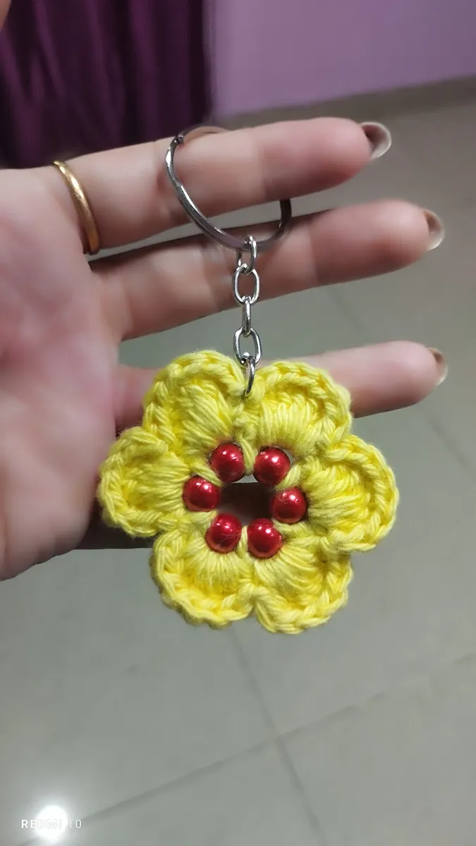Handmade crochet flower keychain in yellow & red