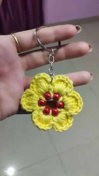 Handmade crochet flower keychain in yellow & red