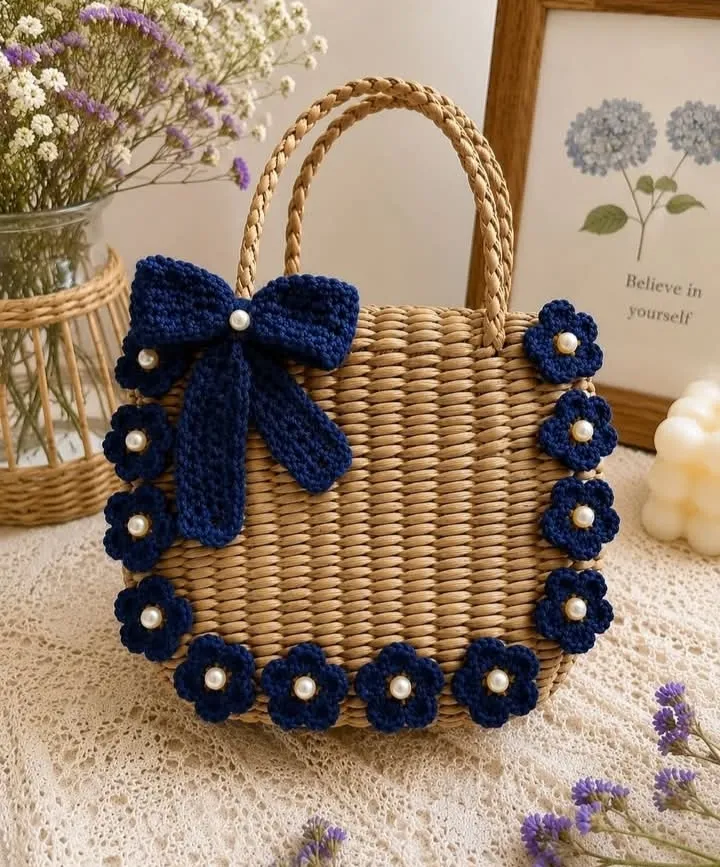Handmade crochet navy flower straw bag in natural straw & navy blue
